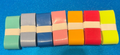 Seven colored baton grips on a blue background